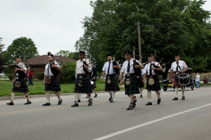The local bagpipe and drum corps. With kilts and aviator shades.